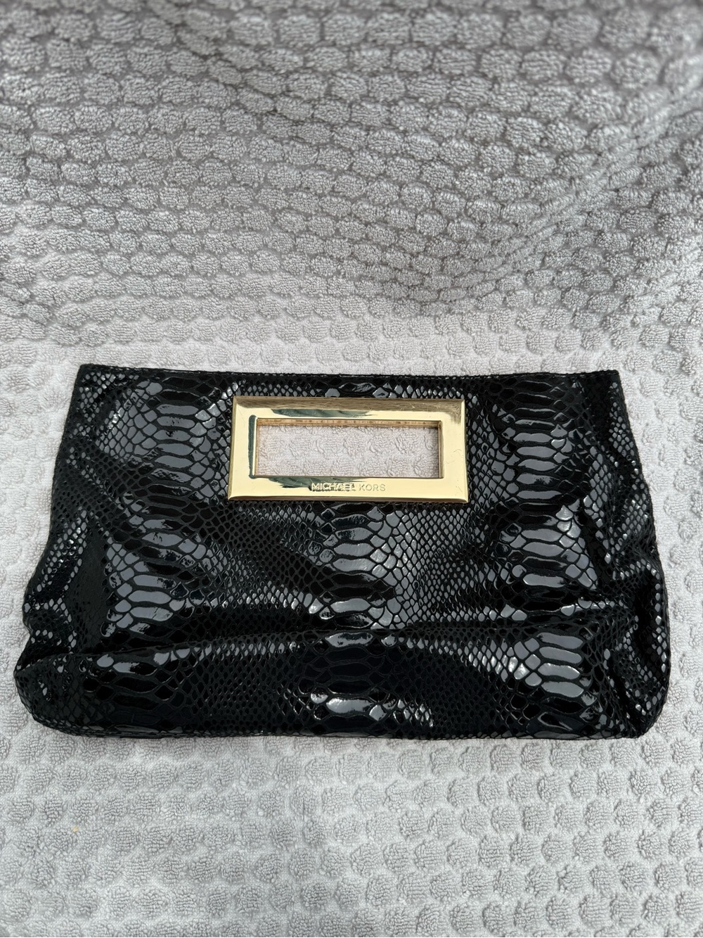 Michael Kors Black Patent Snake-Embossed Clutch with Gold Handle Accent - Picture 1 of 3